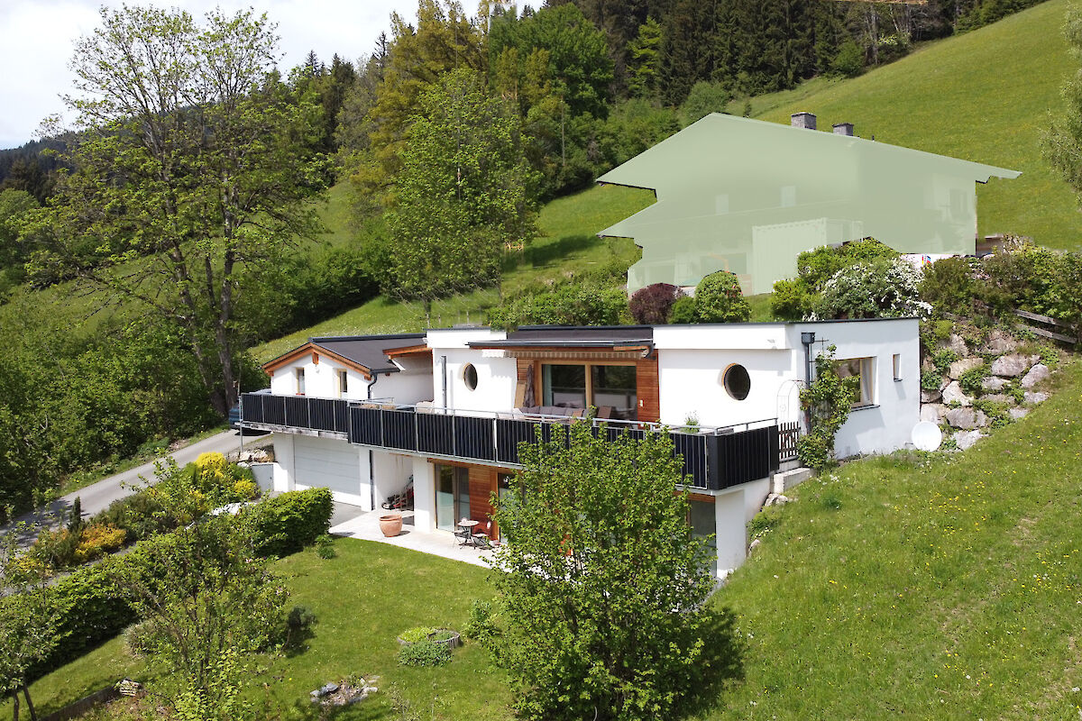 Modern single-family home in an undeveloped location in the open air on the sunny side hill